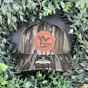 Quack Addict Hat | Duck Hunting Trucker Hat for Men | Waterfowl Camo Hat | Leather Patch Richardson 112 Cap | Gift for Hunters