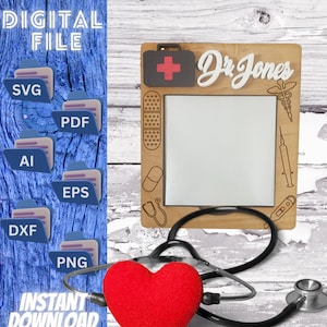 May include: A wooden picture frame with a white background and a red cross, the text "Dr. Jones" and medical symbols. A stethoscope and a red heart are in the foreground.