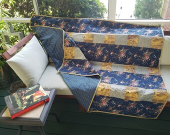 Navy blue and gold floral throw quilt