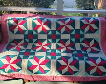 Pink and green throw quilt