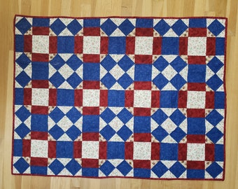 Red and Blue Rolling Stone lap quilt