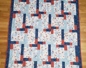 Winter cardinals throw quilt