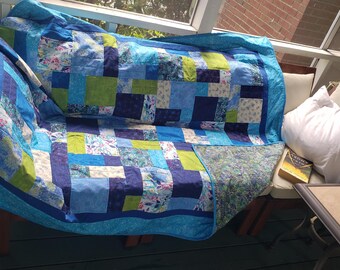 Blue and green throw quilt