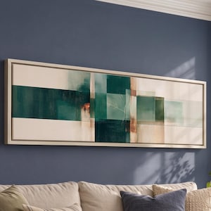 May include: A long, rectangular wall art piece featuring an abstract composition of overlapping geometric shapes in shades of deep teal, forest green, and cream. The artwork is enclosed in a light-colored wooden frame and mounted horizontally.