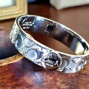 Coach silver bangle deals