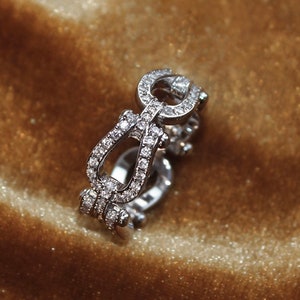Flaming horseshoe elegance ring. Sterling silver 925 ring with shiny zircons. Lucky horseshoe pattern. Everyday contemporary jewelry.