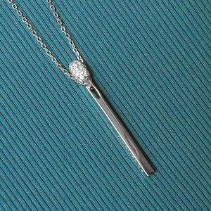 Silver shiny match pendant. Sterling silver 925 safety match encrusted with lab-grown diamonds. Silver Lucifer match necklace with zircons.