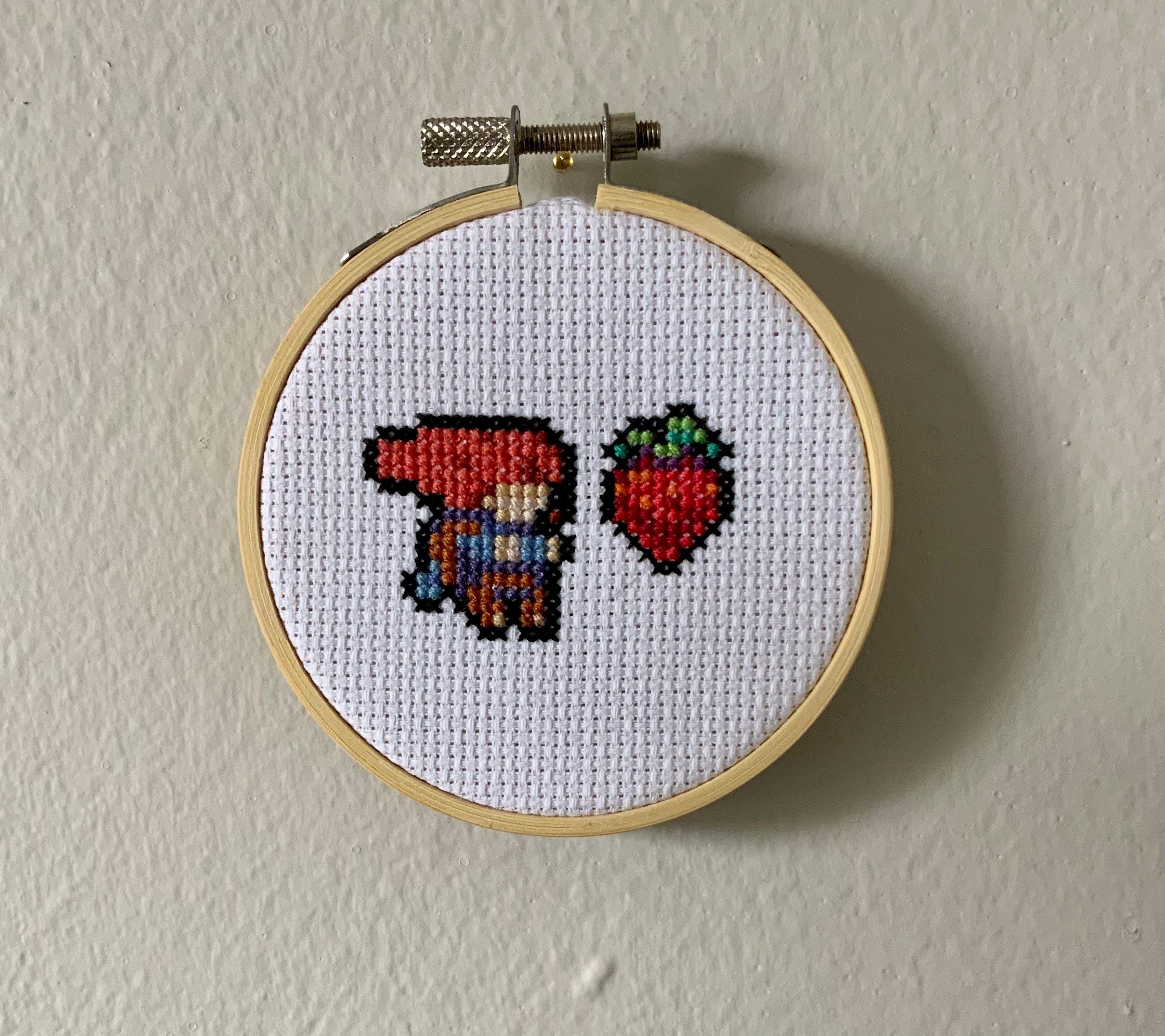 Cross-Stitch Pattern Of Madeline Jumping for a Strawberry