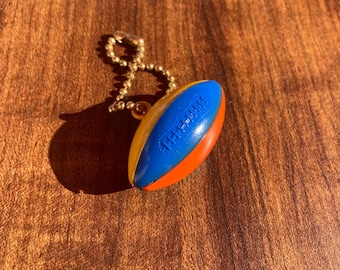 Vintage Football Puzzle Keychain: 1960s Plastic Toy Collectible
