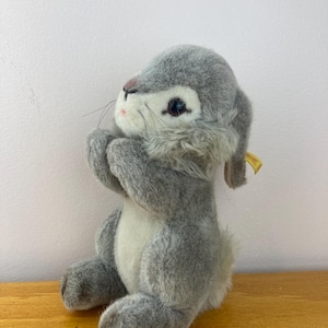 May include: A set of three ceramic mugs with a speckled, matte finish. The mugs are in shades of cream, light gray, and dark gray. Each mug has a simple, minimalist design, perfect for coffee or tea.