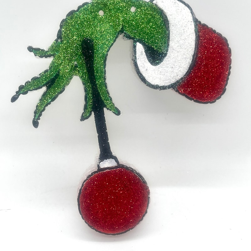 Grinch Holding an Ornament Etsy
