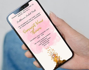 May include: A pink and gold mobile phone invitation for a baby's first Lohri celebration. The invitation features a watercolor background with gold accents and a graphic of a woman holding a lit torch. The text on the invitation reads "Thiara Family would like to invite you to a Sukherani Sahib Fath to celebrate the first Lohri of their beautiful princess Simarjot Kaur Thiara Saturday 1st January 2021 3PM Sri Guru Ramdas Gurdwara Guru Nanak Marg Delhi India"
