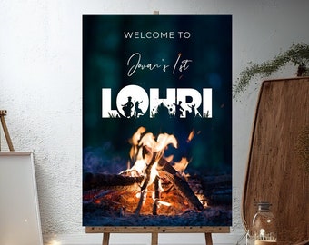 May include: A welcome sign for a Lohri celebration with a bonfire in the background. The sign says "Welcome to Javan's 1st Lohri".