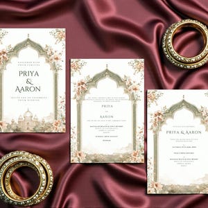Peut inclure: Ensemble de faire-part de mariage avec trois cartes ornées de motifs floraux et architecturaux, et deux bracelets dorés sertis de pierres transparentes. Les cartes affichent les noms "Priya & Aaron". Le fond est un satin rouge foncé.