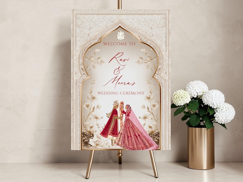Personalised Hindu wedding welcome sign printed on 3mm foamex featuring Ganesha symbol, illustrated bride in red lehenga and groom in red sherwani beneath ornate ivory and gold Mughal arch with delicate floral linework