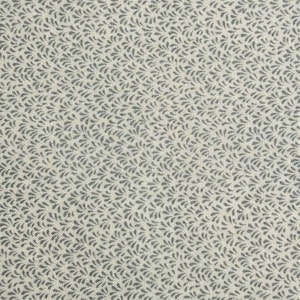 May include: Close-up of a fabric with a repeating pattern of small, dark gray leaf-like shapes on a light beige background. The fabric has a woven texture, creating a subtle grid effect. The design is evenly distributed across the surface.