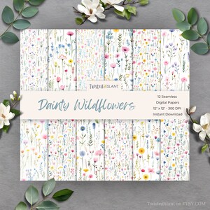 May include: Twelve digital paper designs featuring a seamless pattern of dainty wildflowers in shades of pink, blue, yellow, and green on a white background. The papers are 12 inches by 12 inches and 300 DPI. The text "Dainty Wildflowers" is displayed on the image.
