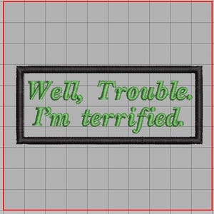 May include: A black and white embroidered patch with green text that reads "Well, Trouble. I'm terrified."