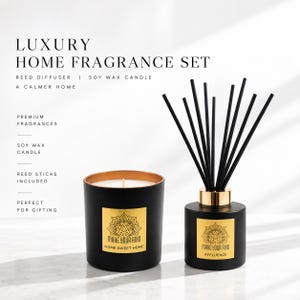 May include: A home fragrance set featuring a black soy wax candle and a reed diffuser with black sticks. Both items have gold labels with the text "MAKE YOUR AVID" and a mandala design. The candle label reads "HOME SWEET HOME" and the diffuser "AFFLUENCE".