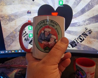 Fred and Rose Gardening murder Christmas mug, dark humour, white mug with red handle and inner.