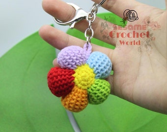 Crochet colorful rainbow flower keychain accessory. Cute rainbow flower keychain decoration for bags. Handmade gift for friends and family.
