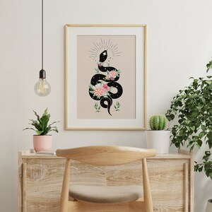 May include: A black snake with a star-filled body is coiled around pink and white flowers. The snake is facing upwards with its head raised. The background is a light beige color.