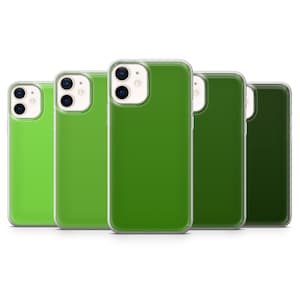 May include: A collection of five green phone cases, each with a different shade of green. The cases have a clear, protective border and are arranged in a row. The phone cases are for a smartphone.