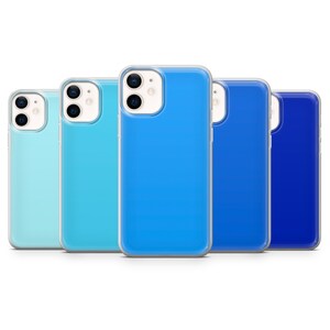 May include: Four clear phone cases with a blue gradient. The cases are arranged from left to right with the lightest blue on the left and the darkest blue on the right.