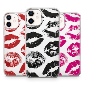 May include: Three clear phone cases with a white background and a pattern of black, red, and pink lips.