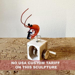 shrimp playing a melodica, wooden automaton