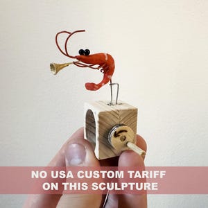 shrimp playing the trumpet, wooden automaton