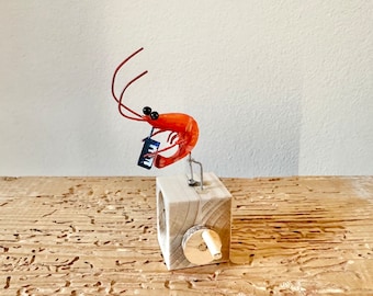 shrimp playing a melodica, wooden automaton
