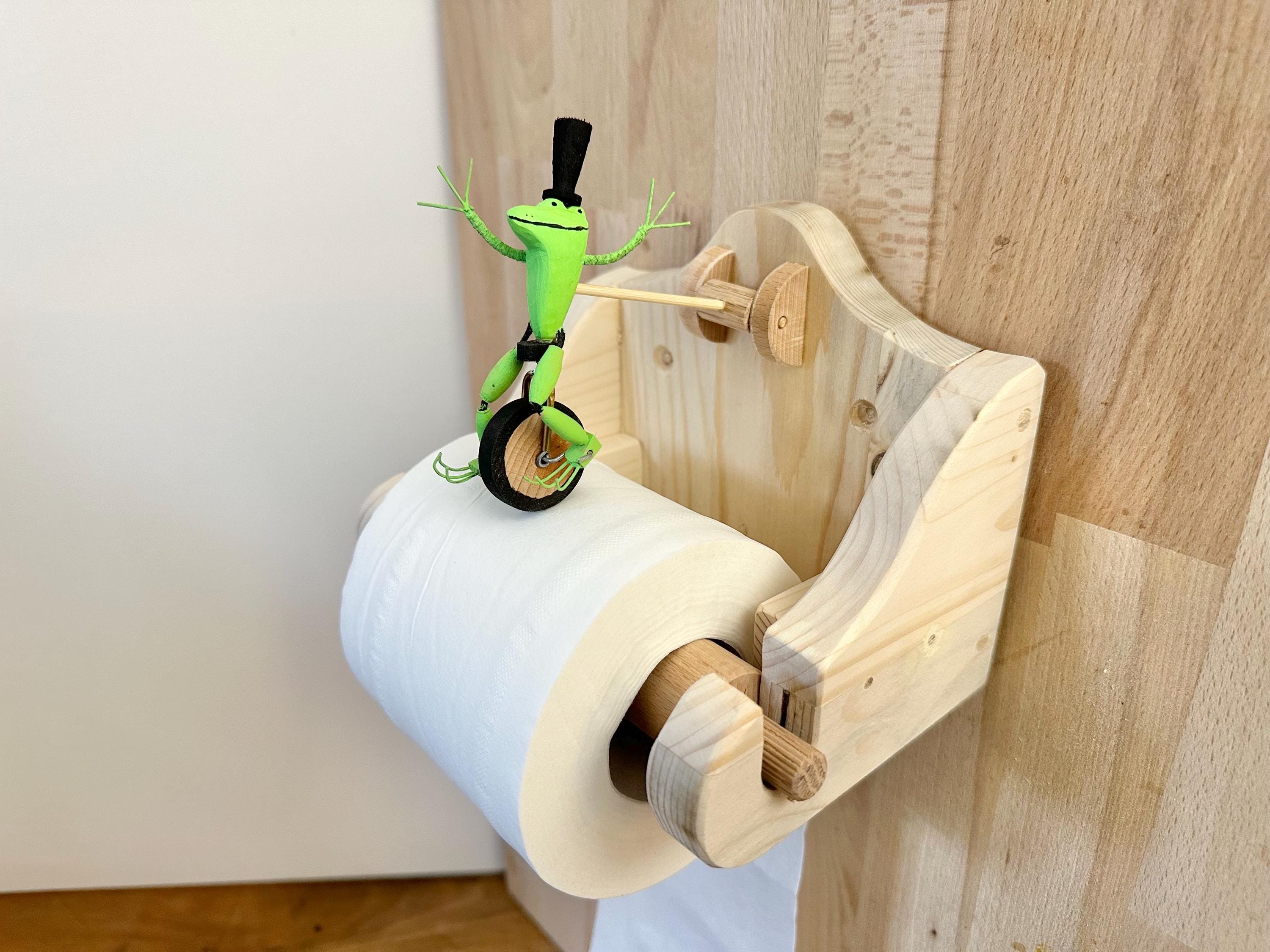 一輪車に乗ったカエル、説明を読む、トイレット ペーパー ホルダー