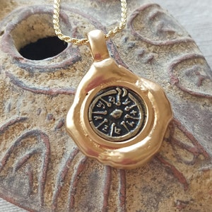 Widow&#39;s mite ancient coin set in A creative Dali style Gold frame