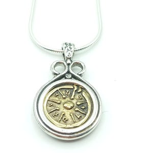 Widow&#39;s mite coin in Sterling silver ornamented bezel