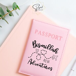 May include: Pink passport cover with the text "PASSPORT" and "Bismillah to new adventures" with a heart and airplane graphic.