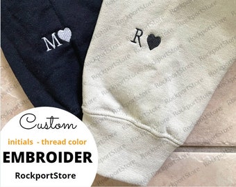 sweatshirt with initial on sleeve