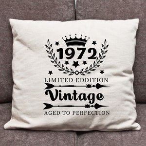 May include: Cream-colored throw pillow with black text and graphics. The design includes the year "1972" inside a laurel wreath, the words "Limited Edition" and "Vintage", and the phrase "Aged to Perfection".