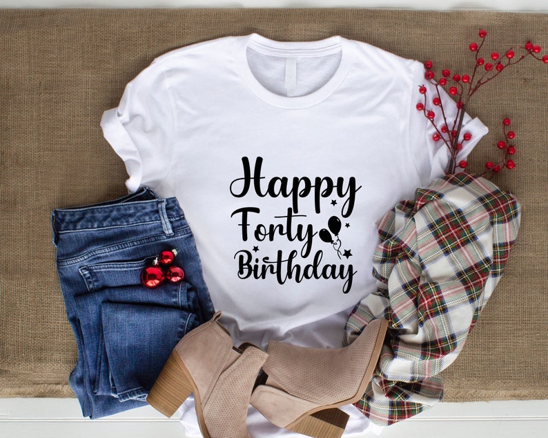 May include: White t-shirt with black text that says "Happy Forty Birthday" with a graphic of balloons and stars.