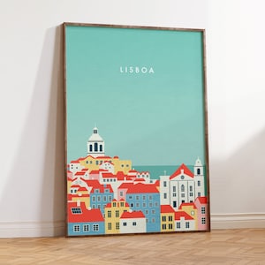 May include: A framed art print featuring a stylized illustration of Lisbon, Portugal. The artwork depicts colorful buildings with red rooftops, set against a teal sky. The word "LISBOA" is printed in white at the top.