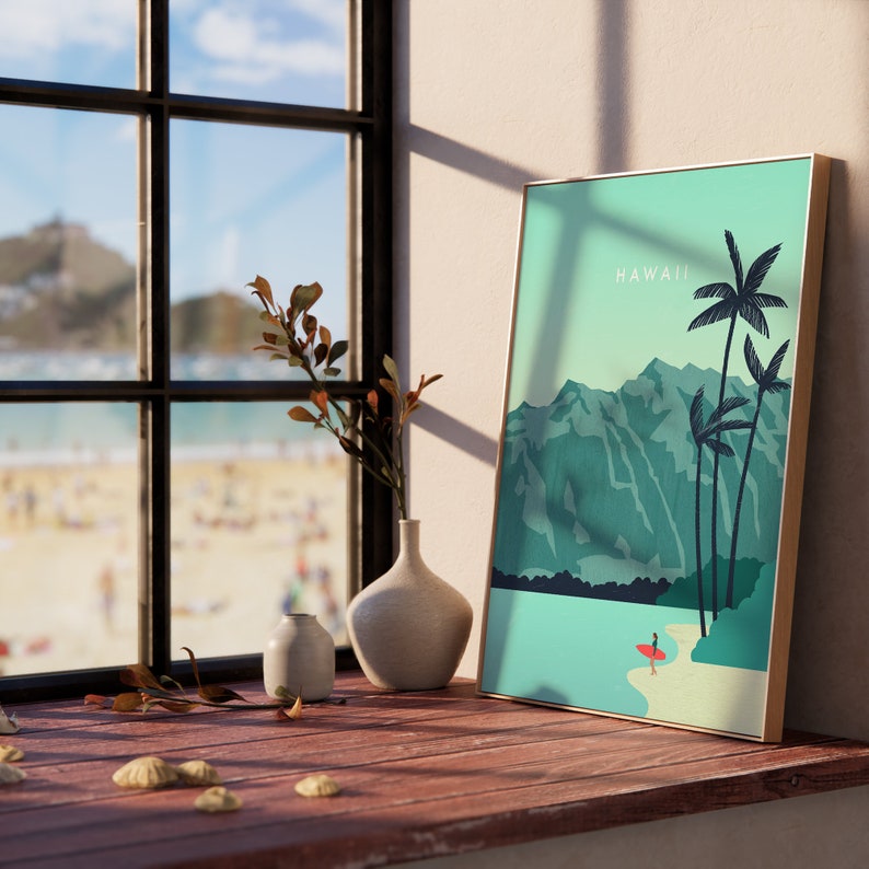 May include: A framed print of a tropical landscape with palm trees and mountains. The print has a light blue background and the word "HAWAII" is written in white text at the top.