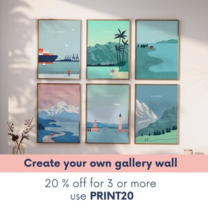 May include: Six framed travel art prints with gold frames, each depicting a different location: Hamburg, Hawaii, Sverige, New Zealand, Bodensee, and Allgau. The prints have a minimalist style with pastel colors. Text on the image reads: "Create your own gallery wall".