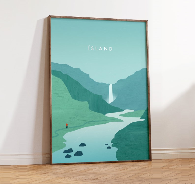 May include: A framed art print featuring a minimalist landscape scene. The artwork depicts a waterfall cascading into a river, with a person in an orange jacket standing on a path. The word "ISLAND" is printed at the top. The color palette includes shades of green and blue.
