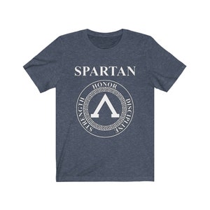 May include: A navy blue t-shirt with a white graphic of a Spartan shield with the words "SPARTAN", "HONOR", "STRENGTH", "DISCIPLINE" around the shield.
