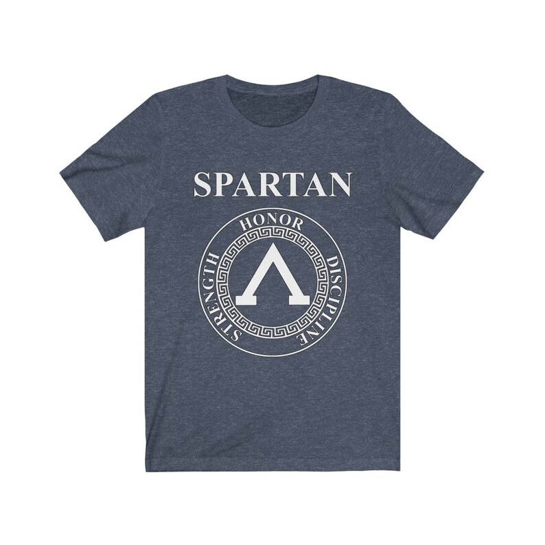 May include: A navy blue t-shirt with a white graphic of a Spartan shield with the words "SPARTAN", "HONOR", "STRENGTH", "DISCIPLINE" around the shield.