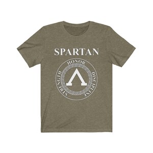 May include: A green t-shirt with a white graphic of a Spartan shield with the words "Spartan", "Honor", "Strength", "Discipline" around the shield.