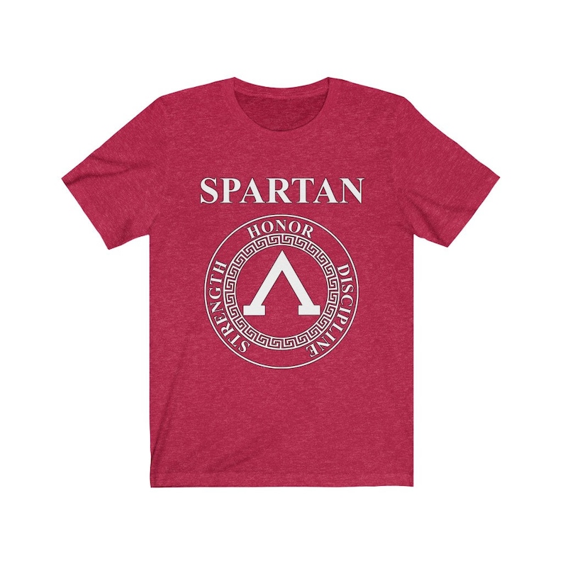 May include: Red heather t-shirt with a white graphic of a Spartan shield with the words "SPARTAN", "HONOR", "STRENGTH", "DISCIPLINE" around the shield.
