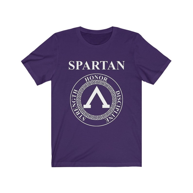 May include: Purple short-sleeved t-shirt with a white graphic of a Spartan helmet with the words "SPARTAN" and "HONOR, STRENGTH, DISCIPLINE" around it.