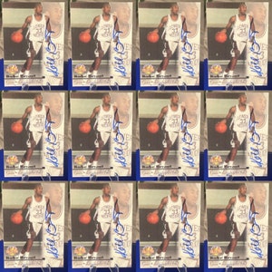 12 Kobe Bryant Scoreboard Rookie Facsimile auto reprint cards! You get 12 cards!