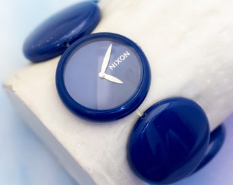 7 inch, Vintage Stylized Blue Circles Plastic Analog Watch by Nixon - J32